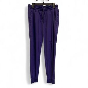 Scrub Joy purple joggers with pockets, drawstring waist and tapered fit